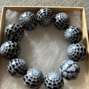 Black and white bracelet with spider web design